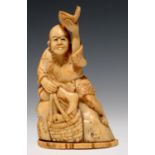 A JAPANESE IVORY OKIMONO OF A FISHERMAN SEATED ON A ROCK, 10.5CM H, SIGNED, MEIJI PERIOD