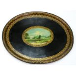 A 19TH C OVAL JAPANNED TINPLATE TEA TRAY, PAINTED TO THE CENTRE WITH A DISTANT VIEW OF A TOWN IN