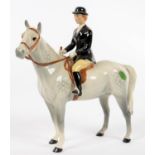 A BESWICK EQUESTRIAN FIGURE OF A HUNTSWOMAN ON A GREY HORSE, 21CM H, PRINTED MARK