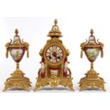 A FRENCH GILTMETAL AND SEVRES STYLE CLARET GROUND   PORCELAIN GARNITURE DE CHEMINEE, PAINTED WITH