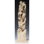 A JAPANESE IVORY MYTHOLOGICAL OKIMONO, THE PRINCIPAL FIGURE STANDING ON A ROCK, 30CM H, SIGNED,