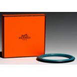 HERMÉS. TEAL LEATHER BANGLE, 62 MM DIAM, BOXED