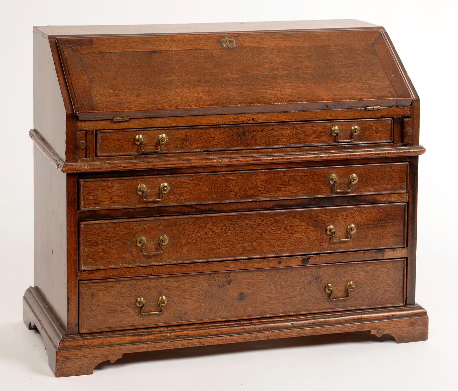 MINIATURE FURNITURE. A GEORGE III STYLE MAHOGANY BUREAU, 26CM H