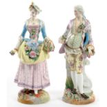 A PAIR OF FRENCH PORCELAIN FIGURES OF A LADY AND GALLANT AS FLOWER GATHERERS, ON FLORAL ENCRUSTED