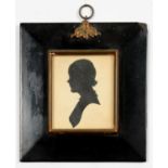 A CUT PAPER SILHOUETTE OF A YOUNG WOMAN, PAPIER MACHE FRAME WITH BRASS HANGER, 16 X 15CM OVERALL