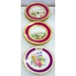 A SET OF EIGHT VICTORIAN BONE CHINA DESSERT PLATES, PAINTED WITH A CENTRAL LANDSCAPE IN CLARET AND