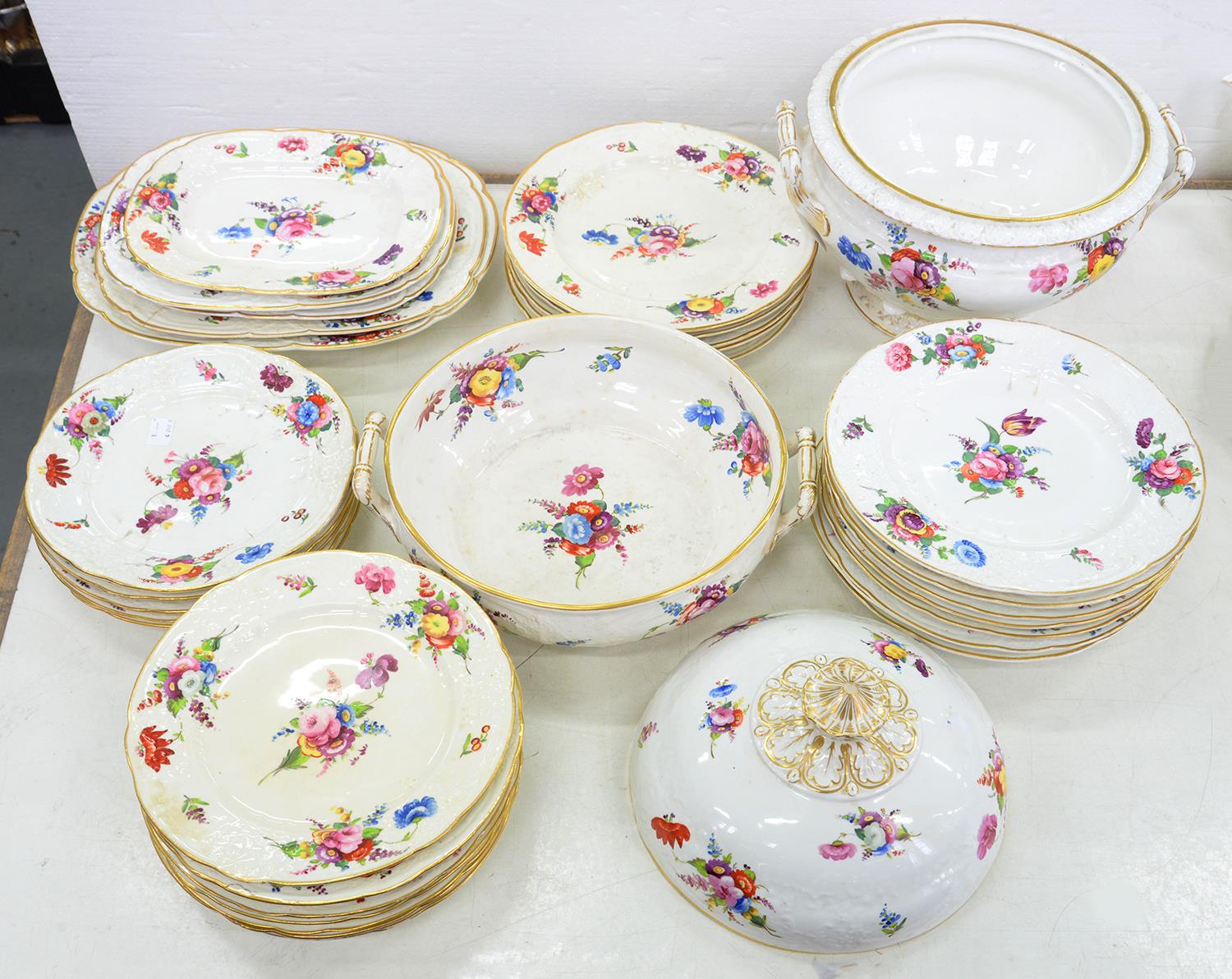 AN EXTENSIVE COALPORT MOULDED DINNER SERVICE PAINTED IN BRIGHT ENAMELS WITH BOUQUETS AND SCATTERED