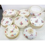 AN EXTENSIVE COALPORT MOULDED DINNER SERVICE PAINTED IN BRIGHT ENAMELS WITH BOUQUETS AND SCATTERED
