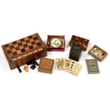 A TURNED BOX WOOD AND EBONY OR SIMILAR TRAVELLING CHESS SET, IN FOLDING GAMES BOX, BOX 20CM L, TWO