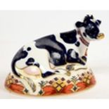 A ROYAL CROWN DERBY FRIESIAN COW 'BUTTERCUP' PAPERWEIGHT, 11CM H, PRINTED MARK, GILT SEAL