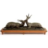 A FRENCH ART DECO BRONZED SPELTER GROUP OF GAZELLES, CAST FROM A MODEL BY L CARVIN, ON WOOD BASE,