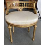 A GILTWOOD AND COMPOSITION SALON CHAIR IN LOUIS XVI STYLE