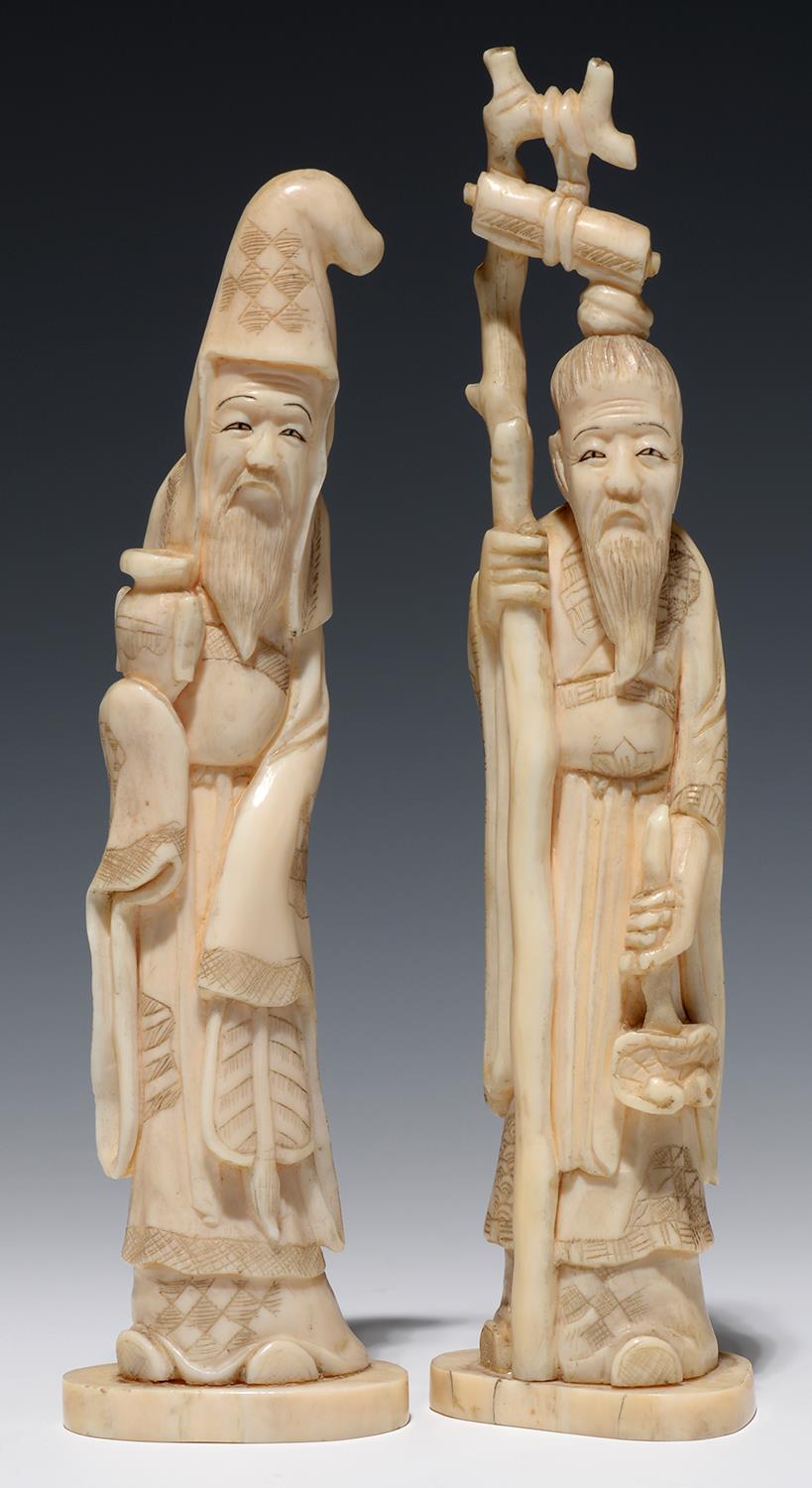 A PAIR OF JAPANESE IVORY OKIMONOS OF IMMORTALS, 14.5CM AND 15.5CM H, MEIJI PERIOD