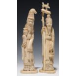 A PAIR OF JAPANESE IVORY OKIMONOS OF IMMORTALS, 14.5CM AND 15.5CM H, MEIJI PERIOD