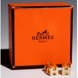 HERMÉS. A PAIR OF WHITE ENAMEL AND GOLD PLATED EARRINGS, 7 X 7 MM, BOXED NO DAMAGE TO ENAMEL