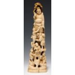 A JAPANESE IVORY OKIMONO OF IMMORTALS, 17CM H, SIGNED IKKO/KAZUMITSU, MEIJI PERIOD