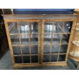 A MAHOGANY GLAZED BOOKCASE, 120CM H X 121CM W