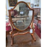 A GEORGE III MAHOGANY SHIELD SHAPED DRESSING MIRROR, 38CM W