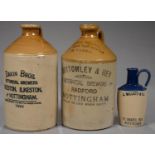 TWO PEARSON AND PRICE SALTGLAZED STONEWARE FLAGONS OF DAKIN BROTHERS BOTANICAL BREWERS BEESTON