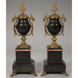 A PAIR OF FRENCH GILT BRASS MOUNTED BELGE NOIR AND MARBLE VASES OF SHIELD SHAPE, ON STEPPED SQUARE