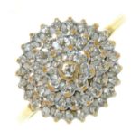 A DIAMOND CLUSTER RING OF TIERED DESIGN, IN 9CT GOLD, LONDON 1991, 2.5G, SIZE M Crown worn from use,