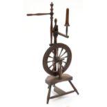 AN EARLY 19TH C TURNED MAHOGANY SPINNING WHEEL, 109CM H Minor scuffs and scratches and an old
