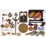 AN OVAL GILTMETAL RNAS BADGE, TWO WWI SOLDIER'S FIBRE TAGS, A GILT BRASS COMPASS, BRONZED METAL