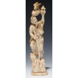 A JAPANESE IVORY OKIMONO OF AN IMMORTAL HOLDING A MINIATURE PAGODA ALOFT, 21CM H, SIGNED BUNSHI/