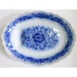 A FLOW BLUE EARTHENWARE MEAT DISH WITH GRAVY TREE AND WELL, BEADED RIM, 51CM L, INDISTINCT PRINTED