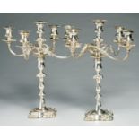 A PAIR OF EPNS FOUR BRANCH CANDELABRA, OF FIVE LIGHTS, IN MID 18TH C ENGLISH STYLE ON SHELL CORNERED