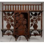 AN AESTHETIC MOVEMENT FRETWORK MURAL CUPBOARD, DECORATED WITH FLOWERS AND RISING SUN, 40CM L,