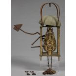 A BRASS AND IRON LANTERN CLOCK WITH ANCHOR ESCAPEMENT AND TURNED FINIALS, 45CM H, 19TH C Found in an