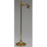 AN EARLY ELECTRIC ADJUSTABLE BRASS READING LAMP WITH SQUARE SECTION SHAFT AND LEAD WEIGHTED FOOT,