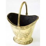 A VICTORIAN BRASS COAL BUCKET, EMBOSSED WITH FESTOONS, ROPE SWING HANDLE, DETACHABLE SHEET BRASS