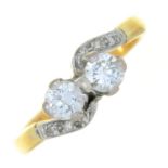 A DIAMOND CROSSOVER RING IN GOLD, MARKED 18CT, 3G, SIZE L ½ NO DAMAGE TO DIAMONDS. BUILDUP OF DIRT