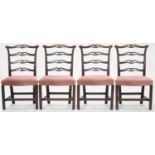 A SET OF FOUR GEORGE III MAHOGANY DINING CHAIRS Back rest on one chair split, minor scuffs and