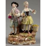 A MEISSEN GROUP OF WINE MAKERS, IN THE GUISE OF A LADY AND GALLANT WITH BOTTLE OR BASKETS OF FRUIT