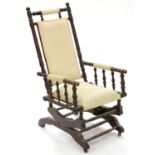 A MAHOGANY AMERICAN ROCKING CHAIR, EARLY 20TH C Some minor signs of old worm, scuffs and scratches