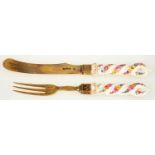 A VICTORIAN PORCELAIN HAFTED SILVER GILT DESSERT KNIFE AND FORK, THE SPIRALLING HAFT PAINTED WITH