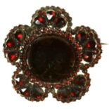 A VICTORIAN GARNET BROOCH WITH LARGER CENTRAL CABOCHON, 46MM D, 14.5G Complete and all original,
