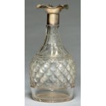 A GEORGE V SILVER MOUNTED CUT GLASS DECANTER, WITH TRIPLE LIPPED NECK, 24CM H, BY W AND G SISSONS,