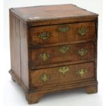 A GEORGE III OAK DWARF CHEST OF DRAWERS WITH BRASS HANDLES, ON BRACKET FEET, 71CM H; 64 X 55CM