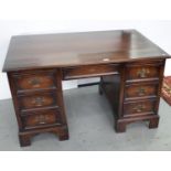 A PANELLED OAK PEDESTAL DESK ON BRACKET FEET, C1930'S, 72CM H; 124 X 74CM Minor scuffs and scratches