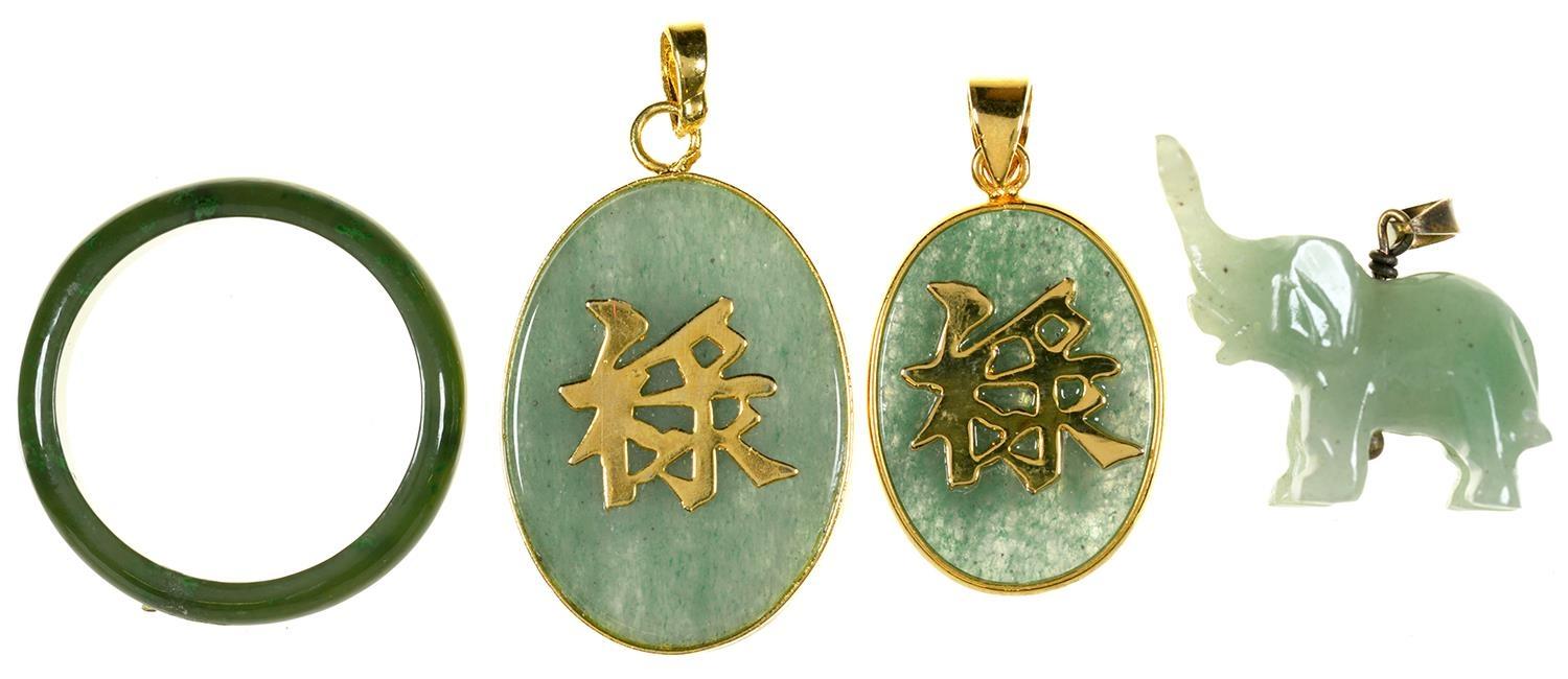 TWO CHINESE GOLD MOUNTED JADE DOUBLE SIDED PENDANTS, A JADE ELEPHANT CHARM AND A NEPHRITE RING