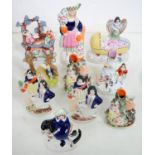 TEN STAFFORDSHIRE EARTHENWARE FLATBACK FIGURES AND GROUPS, TO INCLUDE PAIRS AND SPILL HOLDERS,