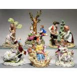 A PLAUE GROUP OF CHILDREN ON A SEESAW, THREE OTHER GERMAN PORCELAIN GROUPS, INCLUDING GRAPE