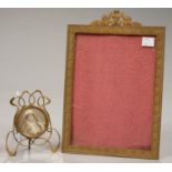 AN EMPIRE STYLE GILT BRASS PHOTOGRAPH FRAME, APERTURE 21.5 X 15.5CM AND AN ART NOUVEAU BRASS WIRE