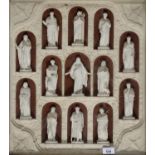 A VICTORIAN PAINTED PLASTER RELIEF OF CHRIST AND THE APOSTLES, EACH IN A PAINTED NICHE AND GOTHIC