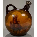 A ROYAL DOULTON KINGSWARE WHISKY FLASK OF GLOBULAR FORM DECORATED WITH FISHING BOATS AND THE HEAD OF