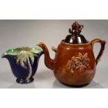 A BARGEWARE TEAPOT AND MATCHED COVER, 36CM H, AND A BESWICK BLUE GROUND EARTHENWARE PALM TREE